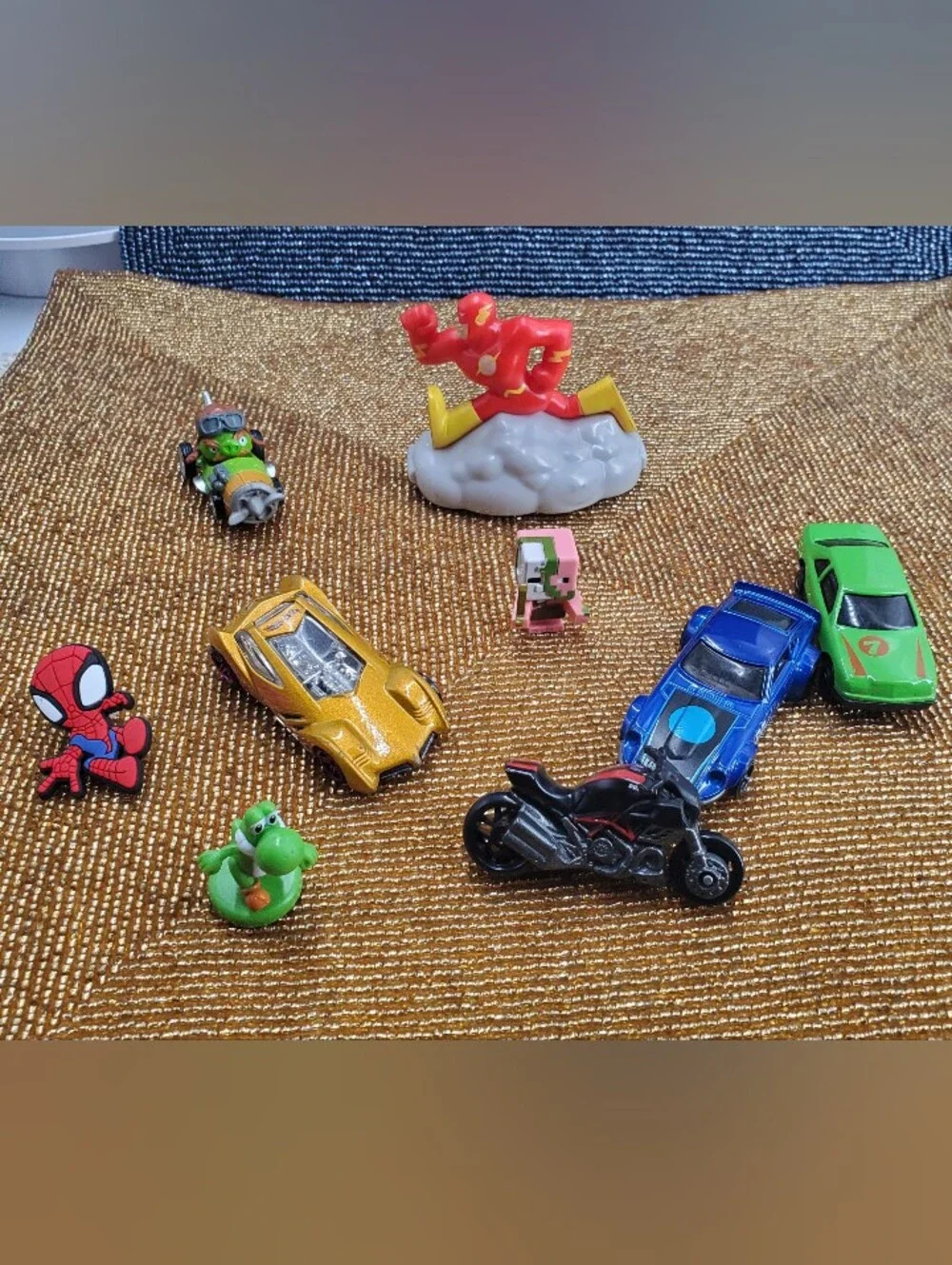 Mix of 9  small toy figures, miniature vehicles, and character charms. (C40)